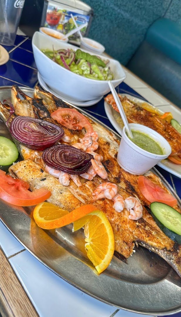 Seafood dishes on a casual Mexican table